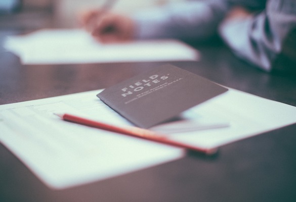 field notes book on desk